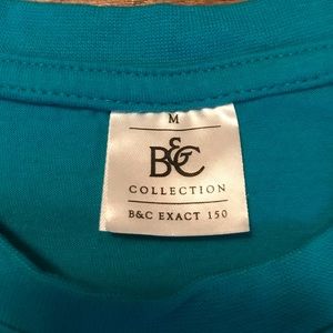 Disney Tops - Epcot Flower and Garden Blue Pocket T-shirt Disney Tops - Epcot Flower and Garden Blue Pocket T-shirt